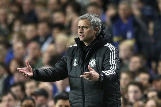 Chelsea's manager Jose Mourinho gestures to his team from the technical area during the Champions League semifinal second leg soccer match between Chelsea and Atletico Madrid at Stamford Bridge stadium in London, Wednesday, April 30, 2014. (AP Photo/Matt Dunham)