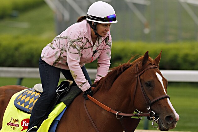 Exercise rider Dana Barnes gallops Kentucky Derby hopeful Chitu after the morning renovation break at Churchill Downs in Louisville, Ky., Thursday, April 24, 2014.  (AP Photo/Garry Jones)