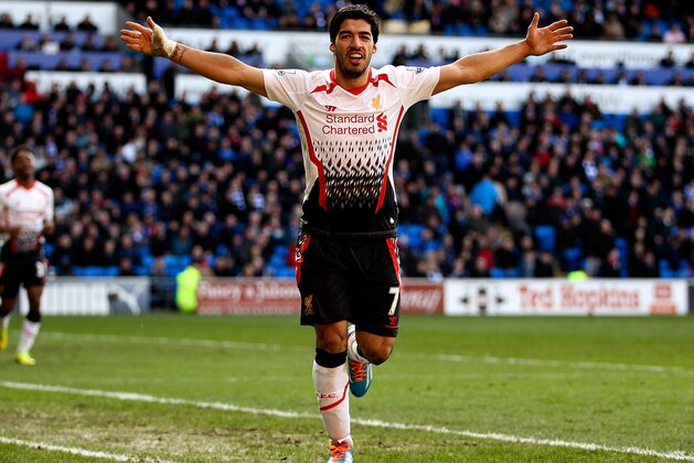 CARDIFF, WALES - MARCH 22:  Luis Suarez of Liverpool celebrates after scoring hihs third and his team's sixth goal of the game during the Barclays Premier League match between Cardiff City and Liverpool at Cardiff City Stadium on March 22, 2014 in Cardiff, Wales.  (Photo by Ben Hoskins/Getty Images)