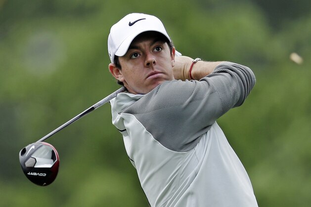 Rory McIlroy watches his tee shot on the 11th hole during the first round of the Wells Fargo Championship golf tournament in Charlotte, N.C., Thursday, May 1, 2014. (AP Photo/Chuck Burton)