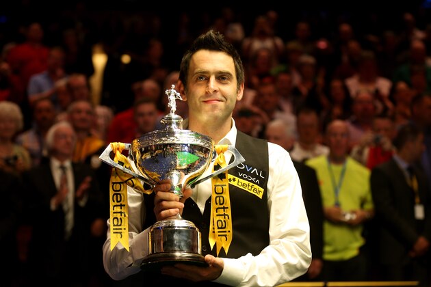 SHEFFIELD, ENGLAND - MAY 06:  Ronnie O'Sullivan of England poses with the trophy and his son Ronnie after beating Barry Hawkins of England to win the Betfair World Snooker Championship at the Crucible Theatre on May 6, 2013 in Sheffield, England.  (Photo by Warren Little/Getty Images)