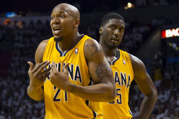 May 22, 2013; Miami, FL, USA; Indiana Pacers power forward David West (left) and center Roy Hibbert (right) react during the second half in game one of the Eastern Conference finals against the Miami Heat of the 2013 NBA Playoffs at American Airlines Arena. Miami wins in overtime 103-102. Mandatory Credit: Steve Mitchell-USA TODAY Sports