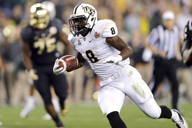 Central Florida running back Storm Johnson (8) runs in for a touchdown against Baylor during the first half of the Fiesta Bowl NCAA college football game, Wednesday, Jan. 1, 2014, in Glendale, Ariz.  (AP Photo/Matt York)