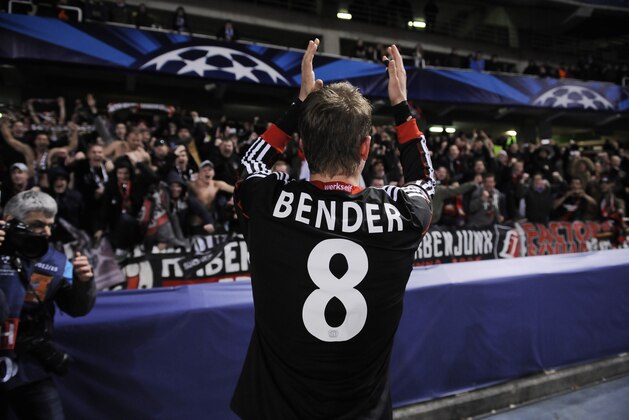 Leverkusen's Lars Bender, celebrates with supporters after his team won the match, 1-0,  against Real Sociedad, during their Champions League Group A soccer match at Anoeta stadium in San Sebastian, northern Spain on Tuesday, Dec. 10, 2013. (AP Photo/Alvaro Barrientos)