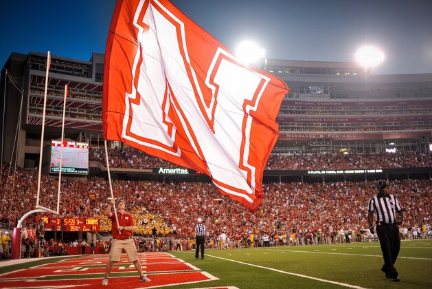 LINCOLN, NE - AUGUST 31: A flag is waved after a Nebraska Cornhuskers during their game against the Wyoming Cowboys at Memorial Stadium on August 31, 2013 in Lincoln, Nebraska.  (Photo by Eric Francis/Getty Images)
