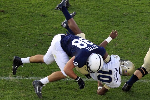 Navy quarterback John Hendrick (10) is sacked by Penn State defensive end Anthony Zettel (98) during the second quarter of an NCAA college football game in State College, Pa., Saturday, Sept. 15, 2012. Penn State won 34-7.(AP Photo/Gene J. Puskar)