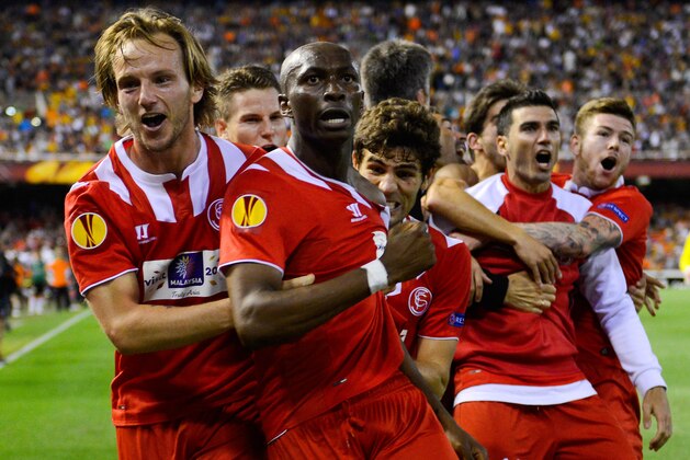 VALENCIA, SPAIN - MAY 01:  Stephane Mbia (C) of Sevilla FC celebrates after scoring his team's first goal during the UEFA Europa League Semi Final second leg match between Valencia CF and Sevilla FC at Estadi de Mestalla on May 1, 2014 in Valencia, Spain.  (Photo by David Ramos/Getty Images)