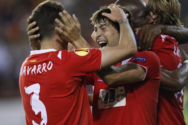 Sevilla's Coke celebrates on the end their Europa League semifinal second leg soccer match against Valencia at the Mestalla stadium in Valencia, Spain, Thursday, May 1, 2014. alencia lost 2-0 in the first leg at Sevilla. The game ended 3-1 and Sevilla qualified for the final Europa League. (AP Photo/Alberto Saiz)