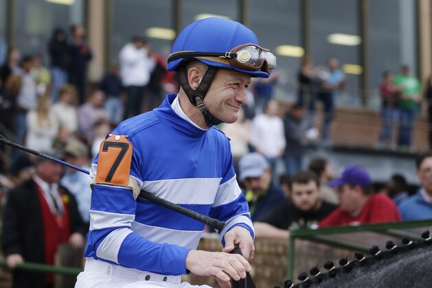 Jockey Calvin Borel rides from the paddock before the $600,000 Rebel Stakes horse race at Oaklawn Park in Hot Springs, Ark., Saturday, March 15, 2014. (AP Photo/Danny Johnston)