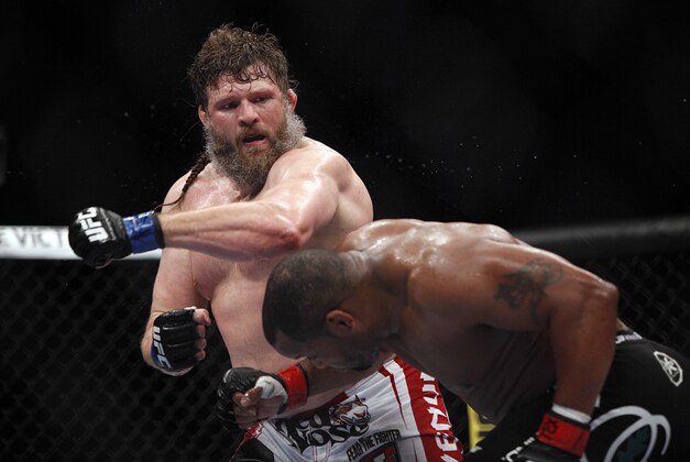 Oct 19, 2013; Houston, TX, USA; Daniel Cormier (red gloves) fights against Roy Nelson (blue gloves) in their heavyweight bout during UFC 166 at Toyota Center. Mandatory Credit: Andrew Richardson-USA TODAY Sports