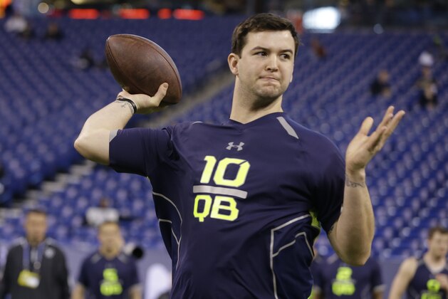 Alabama quarterback AJ McCarron throws during a drill at the NFL football scouting combine in Indianapolis, Sunday, Feb. 23, 2014. (AP Photo/Michael Conroy)