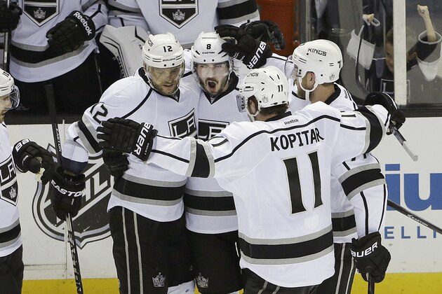 Los Angeles Kings defenseman Drew Doughty, second from left, celebrates with teammates after scoring a goal against the San Jose Sharks during the second period of Game 7 of an NHL hockey first-round playoff series in San Jose, Calif., Wednesday, April 30, 2014. (AP Photo)