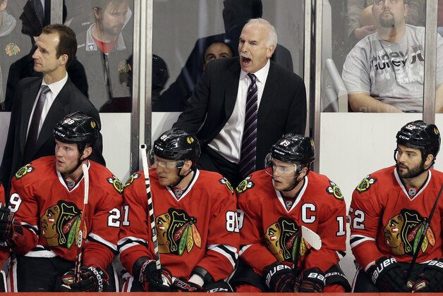 Chicago Blackhawks head coach Joel Quenneville yells his team during the third period in Game 6 of a first-round NHL hockey playoff series against the St. Louis Blues  in Chicago, Sunday, April 27, 2014. The Blackhawks won 5-1. (AP Photo/Nam Y. Huh)