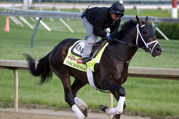 Exercise rider Ovel Merida takes Kentucky Derby entrant Vinceremos for a morning workout at Churchill Downs Thursday, May 1, 2014, in Louisville, Ky. (AP Photo/Morry Gash)