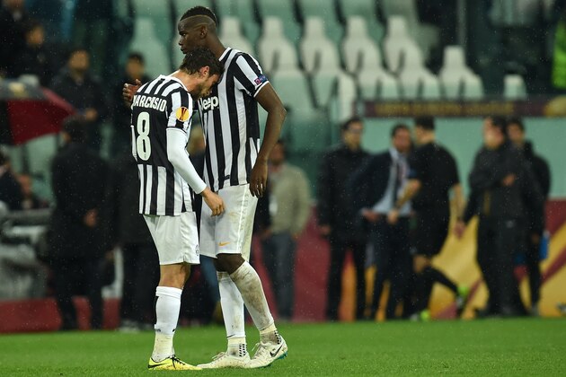 TURIN, ITALY - MAY 01:  Paul Pogba (R) and Claudio Marchisio of Juventus show their dejection at the end of the UEFA Europa League semi final match between Juventus and SL Benfica at Juventus Arena on May 1, 2014 in Turin, Italy.  (Photo by Valerio Pennicino/Getty Images)