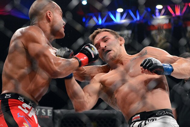 Nov 2, 2013; Long Beach, CA, USA;   Eddie Alvarez (red gloves) and Michael Chandler (blue gloves) during their Bellator lightweight world championship fight at the Long Beach Arena. Chandler won the fight. Mandatory Credit: Jayne Kamin-Oncea-USA TODAY Sports