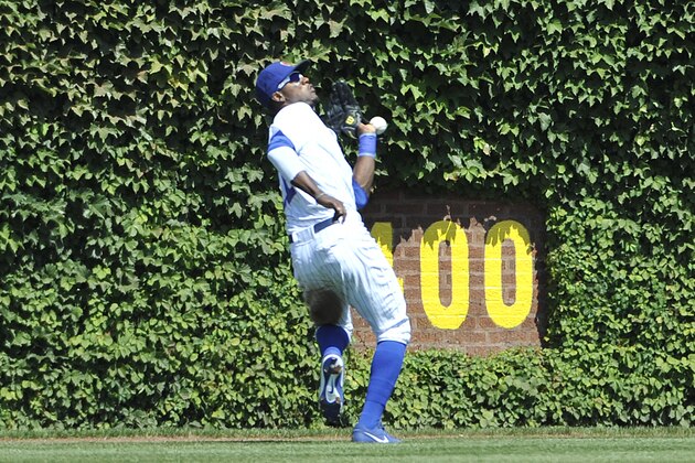 CHICAGO, IL - AUGUST 18: Junior Lake #21 of the Chicago Cubs drops the ball and makes a two base error on a ball hit by  Kolten Wong #16 of the St. Louis Cardinals during the second inning on August 18, 2013 at Wrigley Field in Chicago, Illinois.  (Photo by David Banks/Getty Images)
