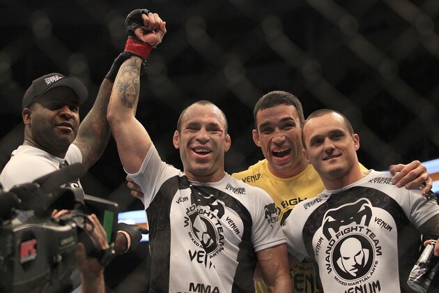 Wanderlei Silva, second from left, celebrates Fabricio Werdum, second from right, and teammates after beating Cung Le during a UFC 139 Mixed Martial Arts middleweight bout in San Jose, Calif., Saturday, Nov. 19, 2011. Silva won by TKO in the second round. (AP Photo/Jeff Chiu)