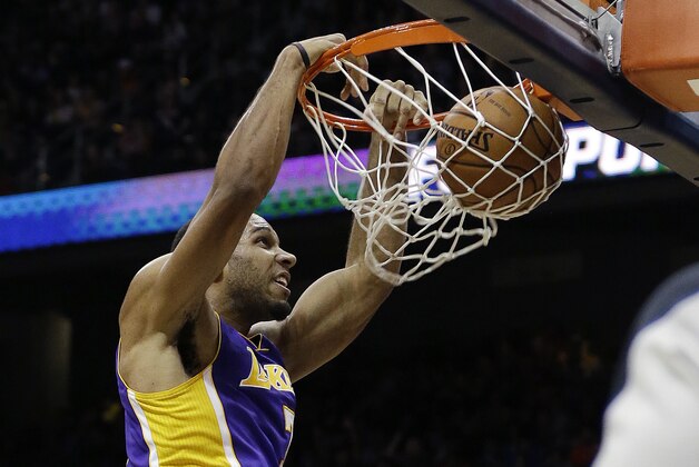 Los Angeles Lakers forward Xavier Henry (7) scores against the Atlanta Hawks in the second half of an NBA basketball game, Monday, Dec. 16, 2013, in Atlanta. The Hawks won 114-100. (AP Photo/John Bazemore)