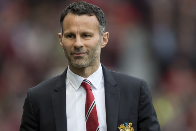 Manchester United's interim manager Ryan Giggs takes to the touchline before his team's English Premier League soccer match against Norwich City at Old Trafford Stadium, Manchester, England, Saturday April 26, 2014. (AP Photo/Jon Super)