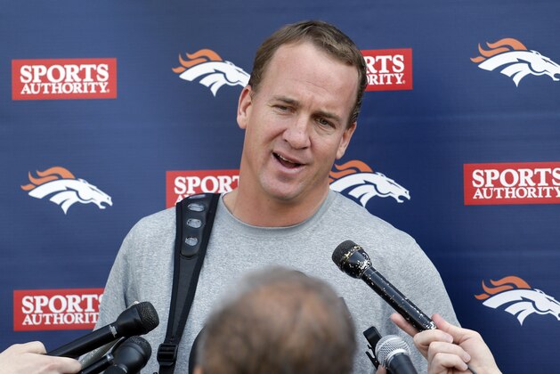 Denver Broncos quarterback Peyton Manning talks to the media after working out at the NFL football teams training facility in Englewood, Colo., on Monday, April 21, 2014. (AP Photo/Ed Andrieski)