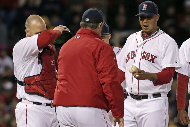 Boston Red Sox starting pitcher Felix Doubront, right, hands the ball to manager John Farrell as he is taken out while trailing the New York Yankees during the third inning of a baseball game on Thursday, April 24, 2014, in Boston. Red Sox catcher David Ross, left, attends. (AP Photo/Charles Krupa)
