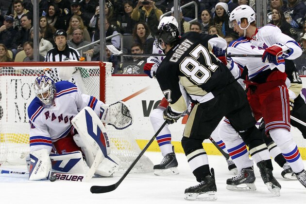 PITTSBURGH, PA - JANUARY 03:  Sidney Crosby #87 of the Pittsburgh Penguins takes a shot on goal against Henrik Lundqvist #30 of the New York Rangers during the game at Consol Energy Center on January 3, 2014 in Pittsburgh, Pennsylvania.  The Penguins defeated the Rangers 5-2.  (Photo by Justin K. Aller/Getty Images)