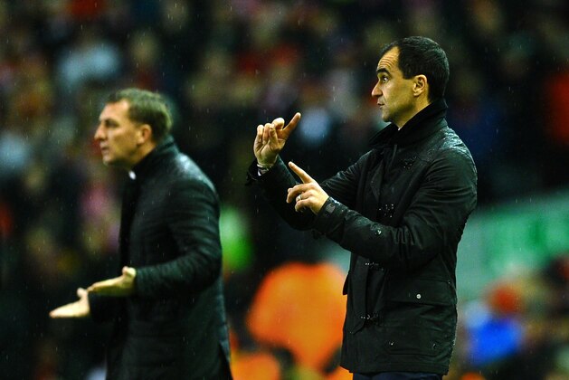LIVERPOOL, ENGLAND - JANUARY 28:  Roberto Martinez the Everton manager directs his players as Brendan Rodgers the Liverpool manager reacts during the Barclays Premier League match between Liverpool and Everton at Anfield on January 28, 2014 in Liverpool, England.  (Photo by Laurence Griffiths/Getty Images)