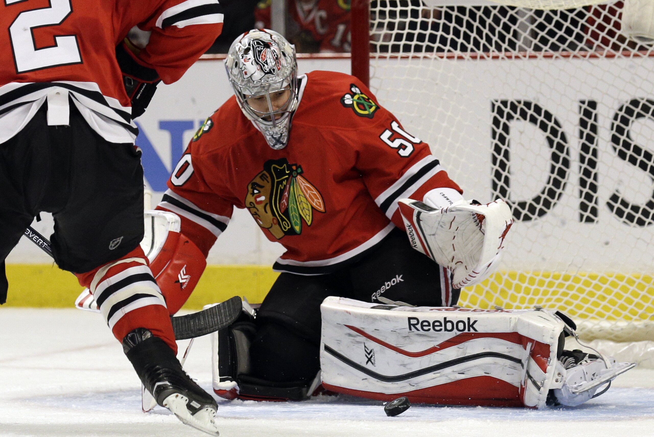 Chicago Blackhawks goalie Corey Crawford blocks a shot during the first period in Game 4 of a first-round NHL hockey playoff series against the St. Louis Blues in Chicago, Wednesday, April 23, 2014. (AP Photo/Nam Y. Huh)
