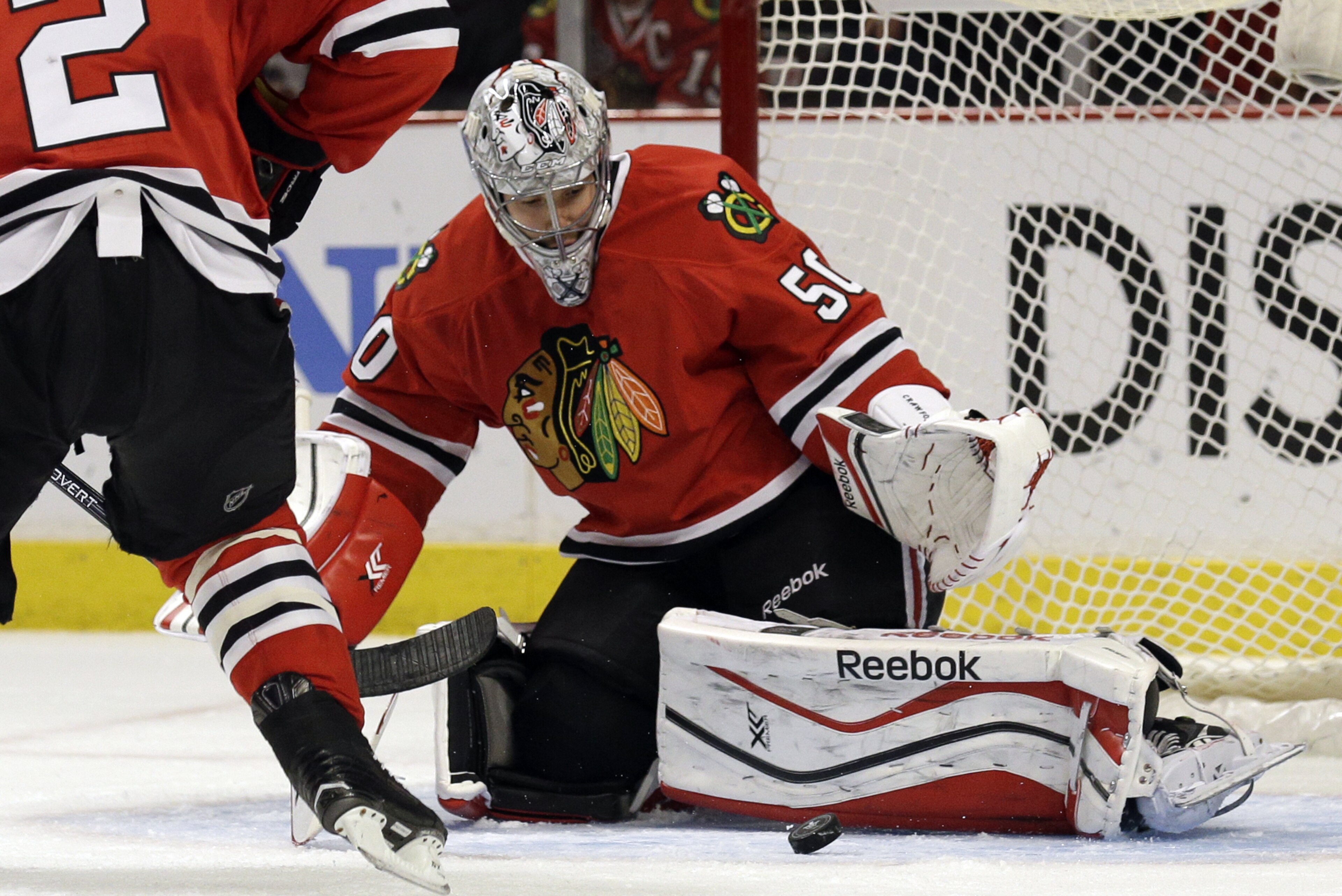 Chicago Blackhawks goalie Corey Crawford blocks a shot during the first period in Game 4 of a first-round NHL hockey playoff series against the St. Louis Blues in Chicago, Wednesday, April 23, 2014. (AP Photo/Nam Y. Huh)