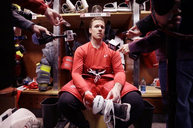 Detroit Red Wings goalie Jimmy Howard addresses the media after participating in the team photo at Joe Louis Arena in Detroit, Tuesday, April 29, 2014. The Red Wings were eliminated by the Boston Bruins in the first round of the Stanley Cup hockey playoffs. (AP Photo/Carlos Osorio)