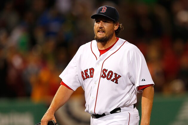 BOSTON, MA - APRIL 10: Joel Hanrahan #52 of the Boston Red Sox leaves the game after giving up a three-run home run to Manny Machado #13 of the Baltimore Orioles in the ninth inning at Fenway Park on April 10, 2013 in Boston, Massachusetts.  The Red Sox lost 8-5. (Photo by Jim Rogash/Getty Images)