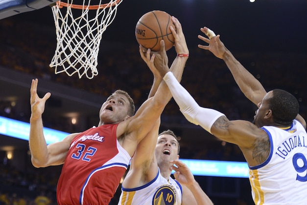May 1, 2014; Oakland, CA, USA; Los Angeles Clippers forward Blake Griffin (32) fights for the rebound with Golden State Warriors forward David Lee (10) and forward Andre Iguodala (9) during the third quarter in game six of the first round of the 2014 NBA Playoffs at Oracle Arena. The Warriors defeated the Clippers 100-99. Mandatory Credit: Kyle Terada-USA TODAY Sports