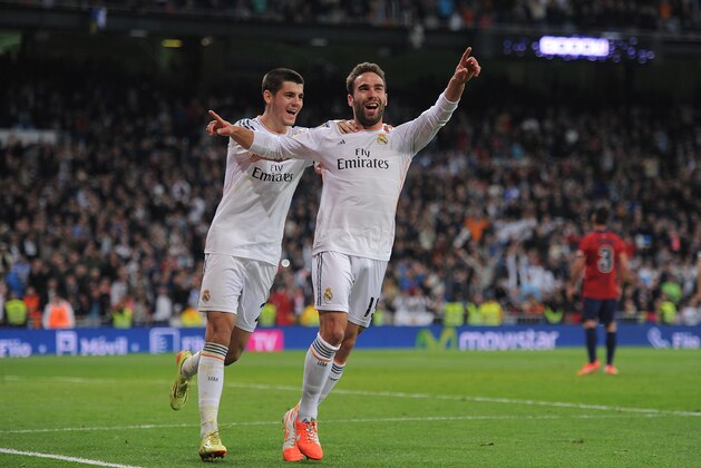 MADRID, SPAIN - APRIL 26:  Daniel Carvajal (R) of Real Madrid CF celebrates with Alvaro Morata after scoring Real's 4th goal from a free kick during the La Liga match between Real Madrid CF and CA Osasuna at the Santiago Bernabeu stadium on April 26, 2014 in Madrid, Spain.  (Photo by Denis Doyle/Getty Images)
