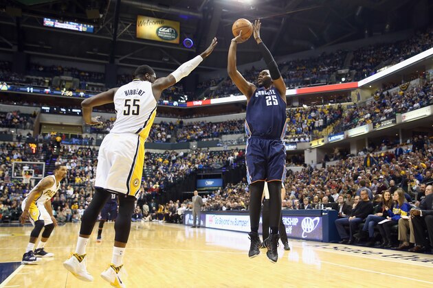 INDIANAPOLIS, IN - DECEMBER 13:  Roy Hibbert #55 of the Indiana Pacers defends the shot by Al Jefferson #25 of the Charlotte Bobcats during the game at Bankers Life Fieldhouse on December 13, 2013 in Indianapolis, Indiana.  NOTE TO USER: User expressly acknowledges and agrees that, by downloading and or using this Photograph, user is consenting to the terms and condition of the Getty Images License Agreement.  (Photo by Andy Lyons/Getty Images)