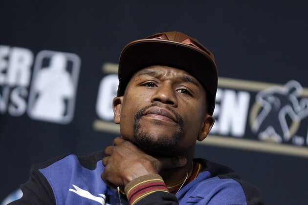 Boxer Floyd Mayweather Jr. listens during a news conference Wednesday, April 30, 2014, in Las Vegas. Mayweather will face Marcos Maidana in a welterweight title fight on Saturday, May 3.  (AP Photo/Isaac Brekken)