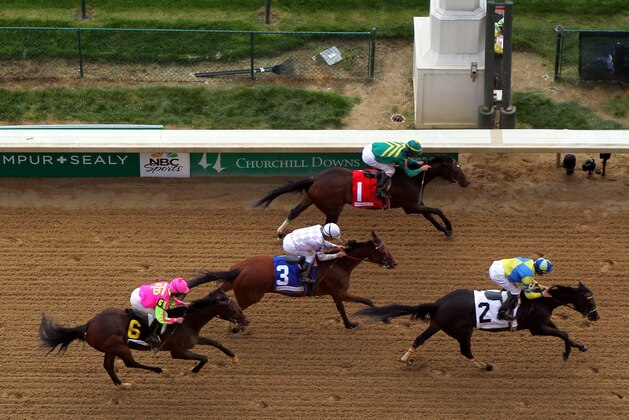 LOUISVILLE, KY - MAY 02:  Tiz Windy #2 leads Handmade #1 and Flipcup #3 across the finish line to win the 3rd race ahead of the 140th Kentucky Oaks at Churchill Downs on May 2, 2014 in Louisville, Kentucky.  (Photo by Jamie Squire/Getty Images)