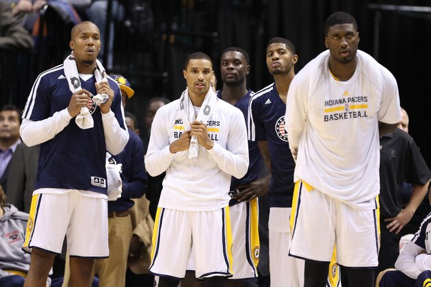 Nov 11, 2013; Indianapolis, IN, USA; Indiana Pacers from left to right forward David West, guard George Hill, guard Lance Stephenson, forward Paul George, and center Roy Hibbert watch the Pacers extend their winning streak to 8-0 against the Memphis Grizzlies at Bankers Life Fieldhouse. Indiana defeats Memphis 95-79. Mandatory Credit: Brian Spurlock-USA TODAY Sports
