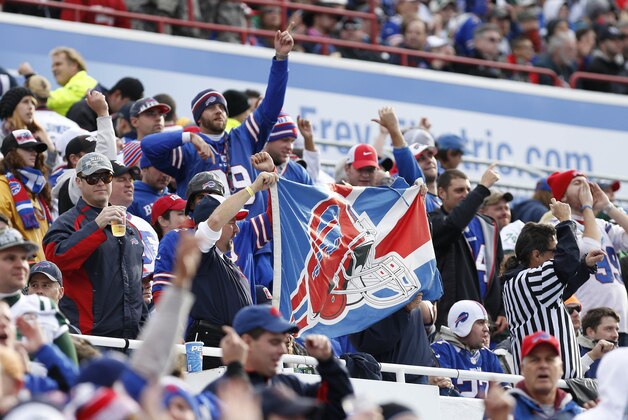 Nov 17, 2013; Orchard Park, NY, USA; Buffalo Bills fans celebrate a touchdown by the team during the first half against the New York Jets at Ralph Wilson Stadium. Mandatory Credit: Kevin Hoffman-USA TODAY Sports