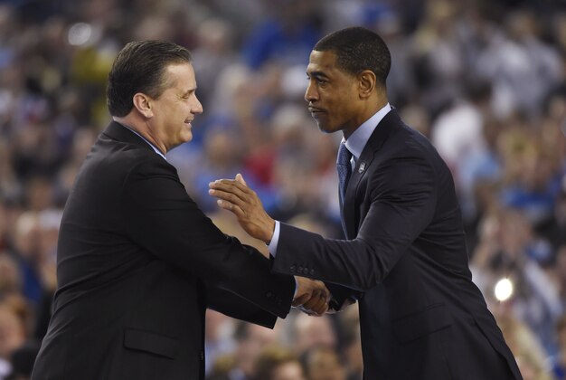 Apr 7, 2014; Arlington, TX, USA; Kentucky Wildcats head coach John Calipari shakes hands with Connecticut Huskies head coach Kevin Ollie before the championship game of the Final Four in the 2014 NCAA Mens Division I Championship tournament at AT&T Stadium. Mandatory Credit: Robert Deutsch-USA TODAY Sports
