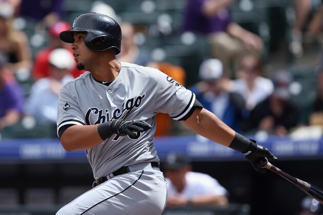 DENVER, CO - APRIL 09:  Jose Abreu #79 of the Chicago White Sox hits a double off of starting pitcher Juan Nicasio #12 of the Colorado Rockies in the first inning during Interleague play at Coors Field on April 9, 2014 in Denver, Colorado.  (Photo by Doug Pensinger/Getty Images)