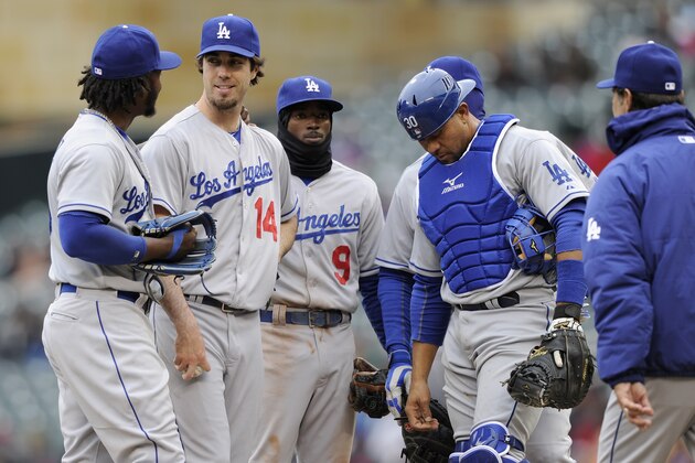 MINNEAPOLIS, MN - MAY 1: Hanley Ramirez #13 of the Los Angeles Dodgers congratulates teammate Dan Haren #14 as manager Don Mattingly #8 walks to mound to relieve Haren during the seventh inning in game one of a doubleheader against the Minnesota Twins on May 1, 2014 at Target Field in Minneapolis, Minnesota. The Dodgers defeated the Twins 9-4. (Photo by Hannah Foslien/Getty Images)
