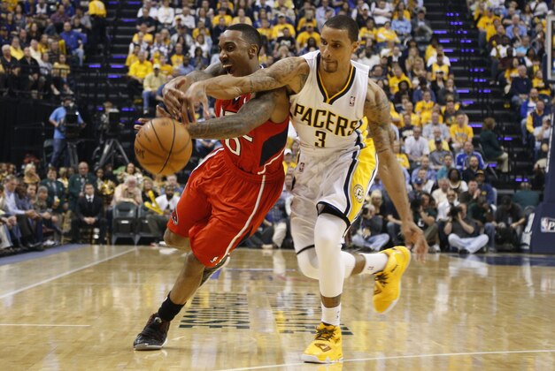 Apr 28, 2014; Indianapolis, IN, USA; Atlanta Hawks guard Jeff Teague (0) battles for a loose ball with Indiana Pacers guard George Hill (3) in game five of the first round of the 2014 NBA Playoffs at Bankers Life Fieldhouse. Mandatory Credit: Brian Spurlock-USA TODAY Sports