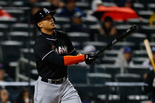 NEW YORK, NY - APRIL 26:  Giancarlo Stanton #27 of the Miami Marlins connects for a two run home run in the sixth inning against the New York Mets at Citi Field on April 26, 2014 in the Flushing neighborhood of the Queens borough of New York City. Marlins defeated the Mets 7-6 in ten inning (Photo by Mike Stobe/Getty Images)