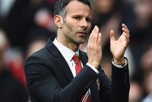 MANCHESTER, ENGLAND - APRIL 26:  Ryan Giggs of Manchester United applauds the fans after a rousing victory in his first match as manager during the Barclays Premier League match between Manchester United and Norwich City at Old Trafford on April 26, 2014 in Manchester, England.  (Photo by Laurence Griffiths/Getty Images)