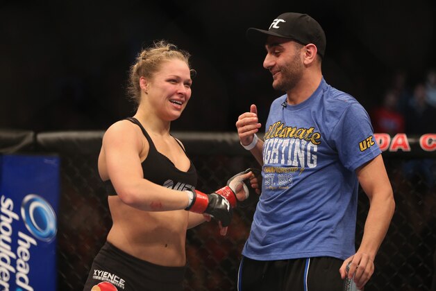 ANAHEIM, CA - FEBRUARY 23:  Ronda Rousey celebrates her UFC Bantamweight Title over Liz Carmouche with a member of her team at Honda Center on February 23, 2013 in Anaheim, California.  (Photo by Jeff Gross/Getty Images)
