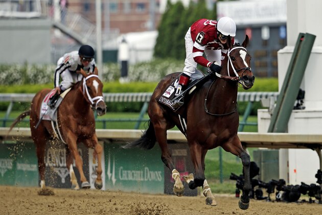 Rosie Napravnik rides Untapable to victory during the 140th running of the Kentucky Oaks horse race at Churchill Downs Friday, May 2, 2014, in Louisville, Ky. (AP Photo/Tim Donnelly)