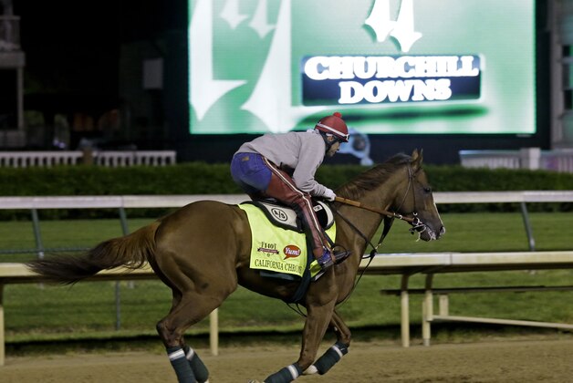 Exercise rider William Delgado takes Kentucky Derby entrant California Chrome for a morning workout during a morning workout at Churchill Downs Friday, May 2, 2014, in Louisville, Ky. (AP Photo/Morry Gash)