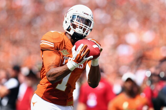 DALLAS, TX - OCTOBER 12:  Mike Davis #1 of the Texas Longhorns pulls in a touchdown pass in the end zone turnover score against the Oklahoma Sooners in the third quarter at the Cotton Bowl on October 12, 2013 in Dallas, Texas. The Longhorns beat the Sooners 36-20.  (Photo by Tom Pennington/Getty Images)