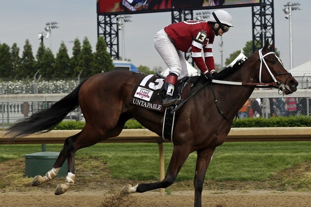 Rosie Napravnik rides Untapable to victory during the 140th running of the Kentucky Oaks horse race at Churchill Downs Friday, May 2, 2014, in Louisville, Ky. (AP Photo/Darron Cummings)